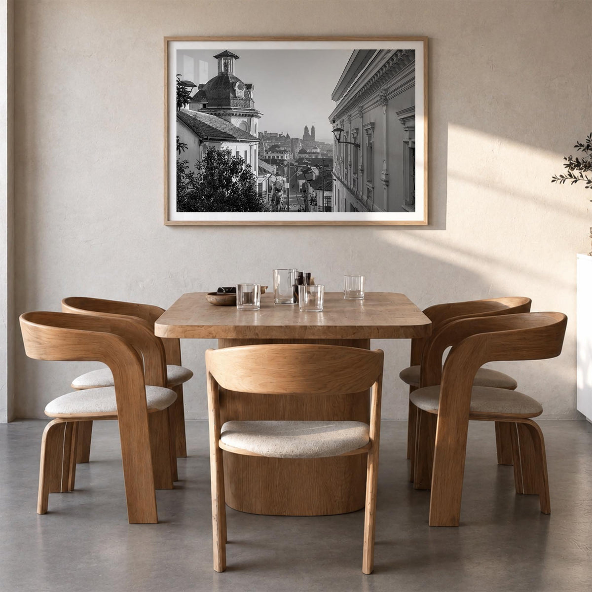 Quito black & white photo poster of Ecuador – horizontal wall art in natural wood frame with white border, hanging on wall