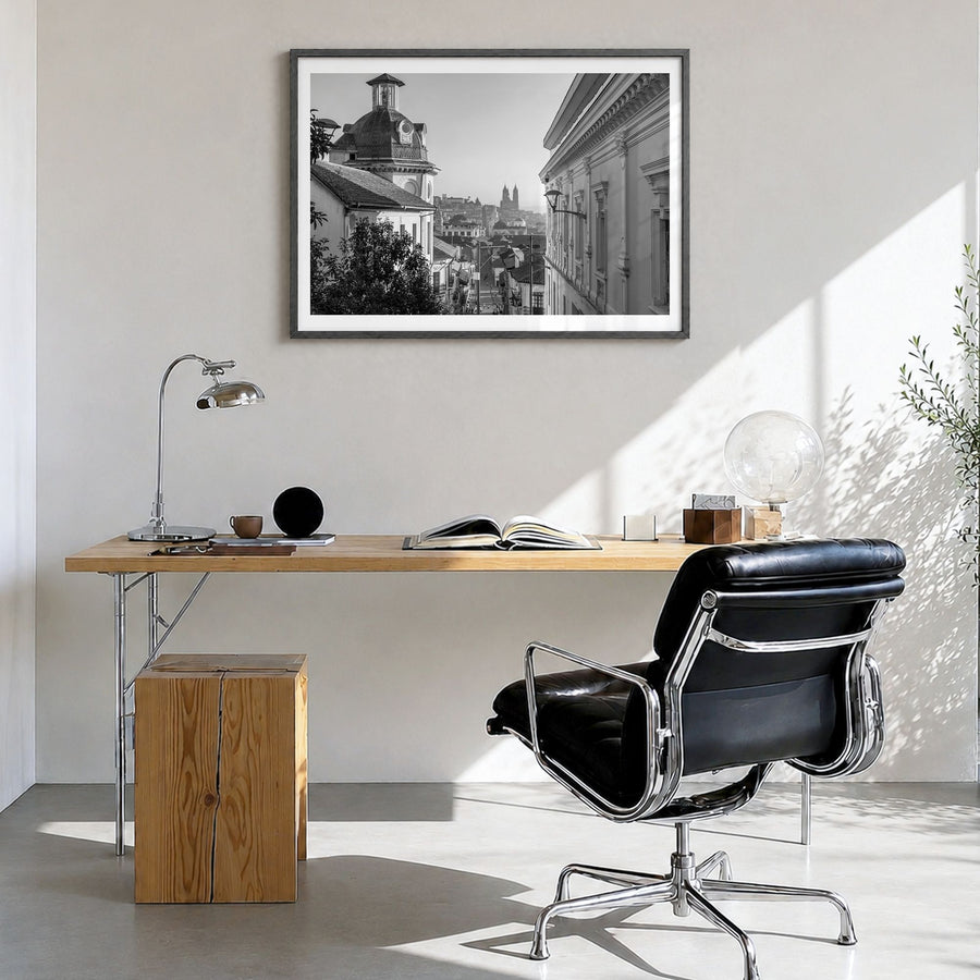 Quito Photo Poster in a black wood frame, hanging in a bright home office, white border