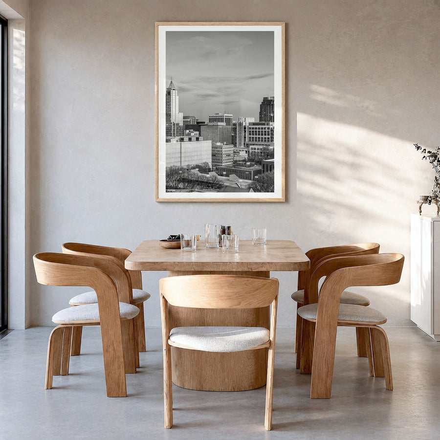 Raleigh Photo No 1 Poster in a natural wood frame, hanging in a dining room, white border