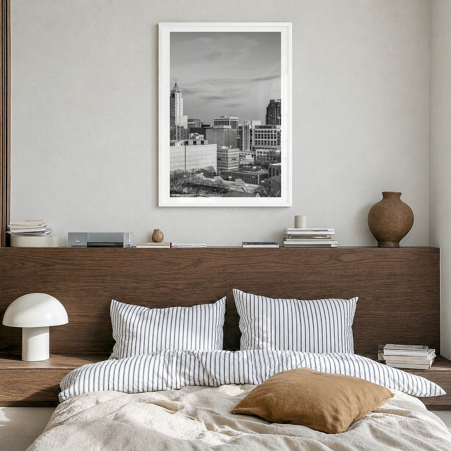 Raleigh Photo No 1 Poster in a white wood frame, hanging in a bedroom, white border