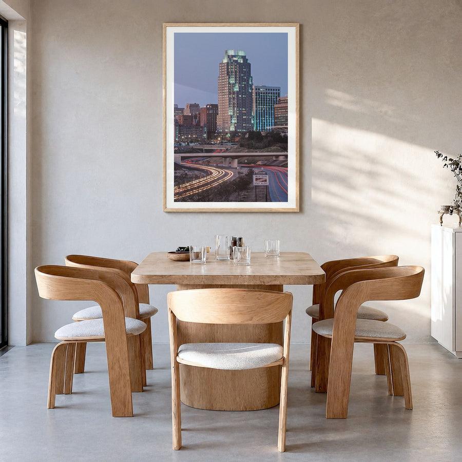 Raleigh Photo No 3 Poster in a natural wood frame, hanging in a dining room, white border