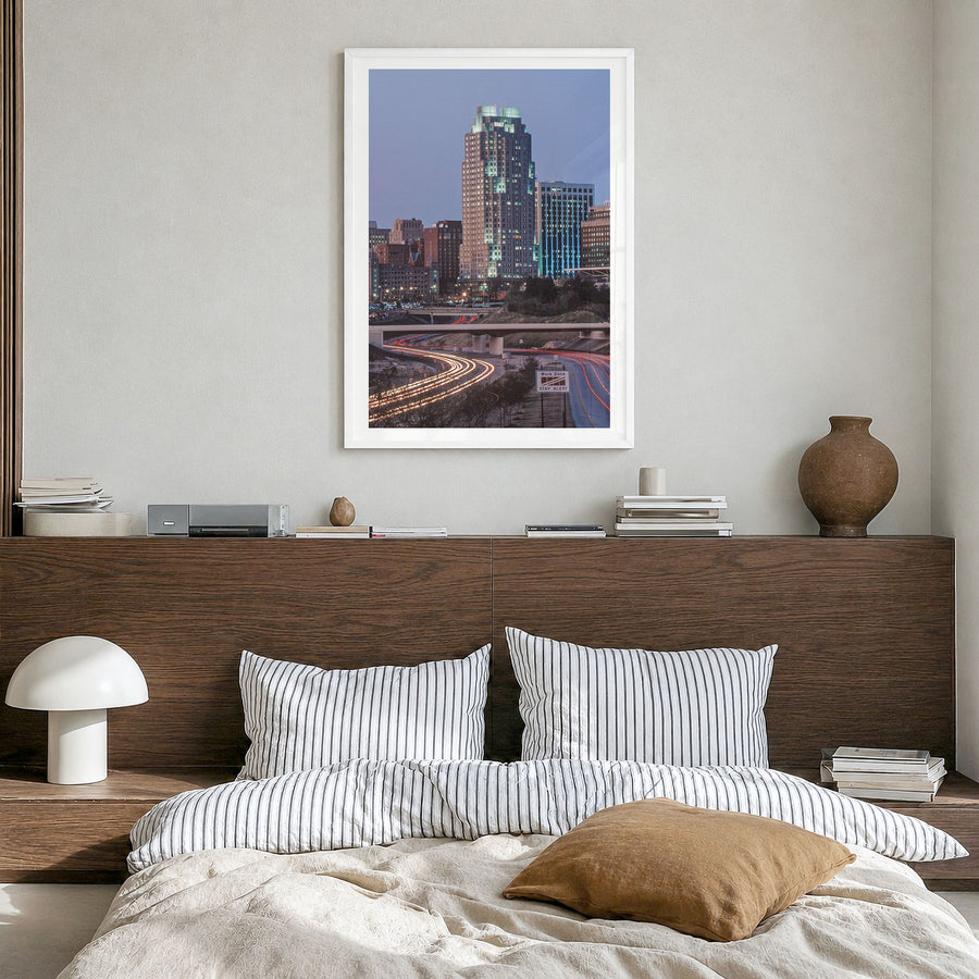Raleigh Photo No 3 Poster in a white wood frame, hanging in a bedroom, white border