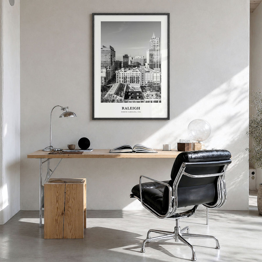 Raleigh Classic No 1 Poster in a black wood frame, hanging in a bright home office