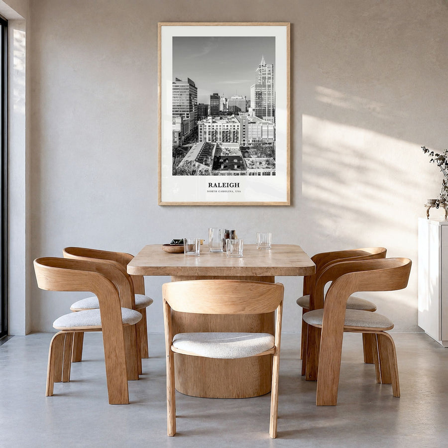 Raleigh Classic No 1 Poster in a natural wood frame, hanging in a dining room