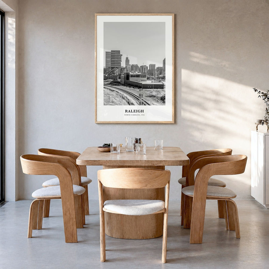 Raleigh Classic No 2 Poster in a natural wood frame, hanging in a dining room