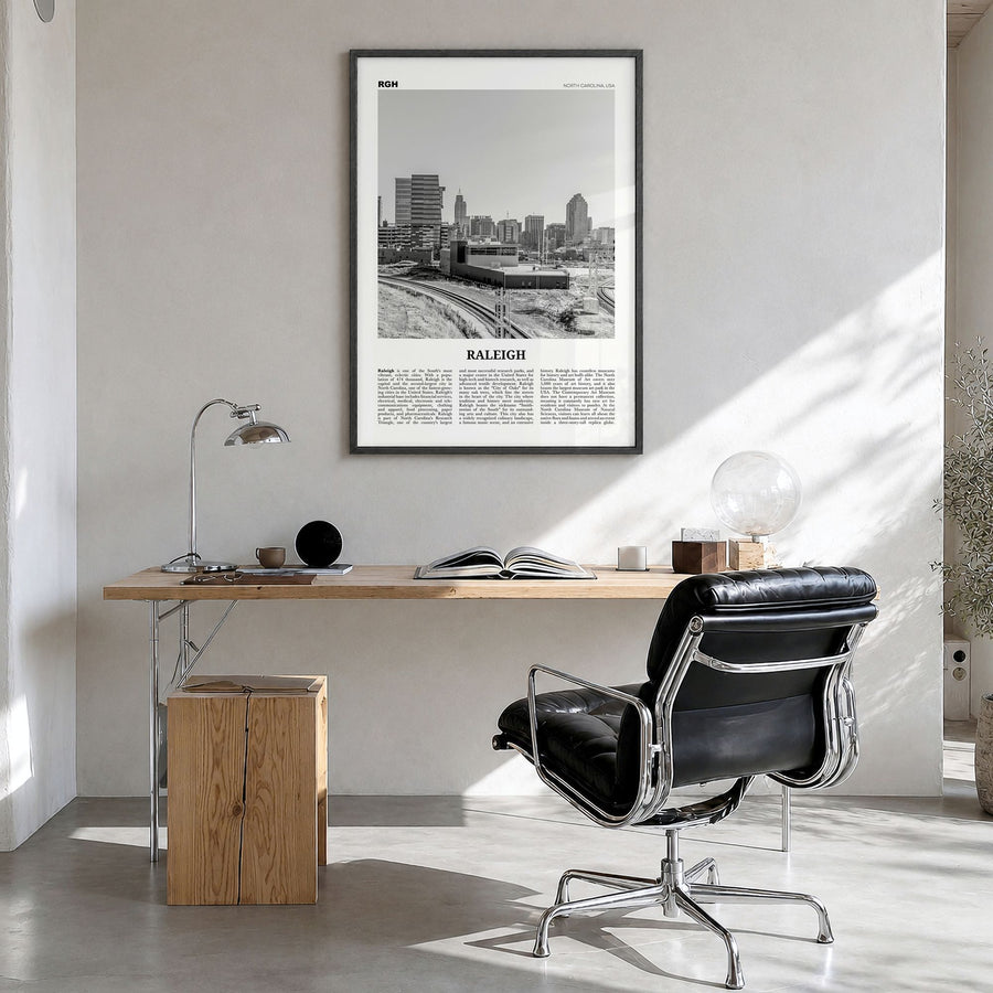 Raleigh Newspaper No 2 Poster in a black wood frame, hanging in a bright home office