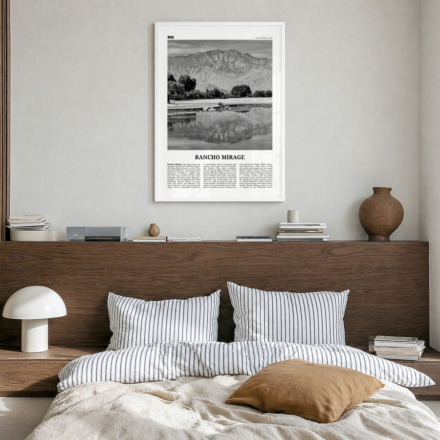 Rancho Mirage Newspaper Poster in a white wood frame, hanging in a bedroom