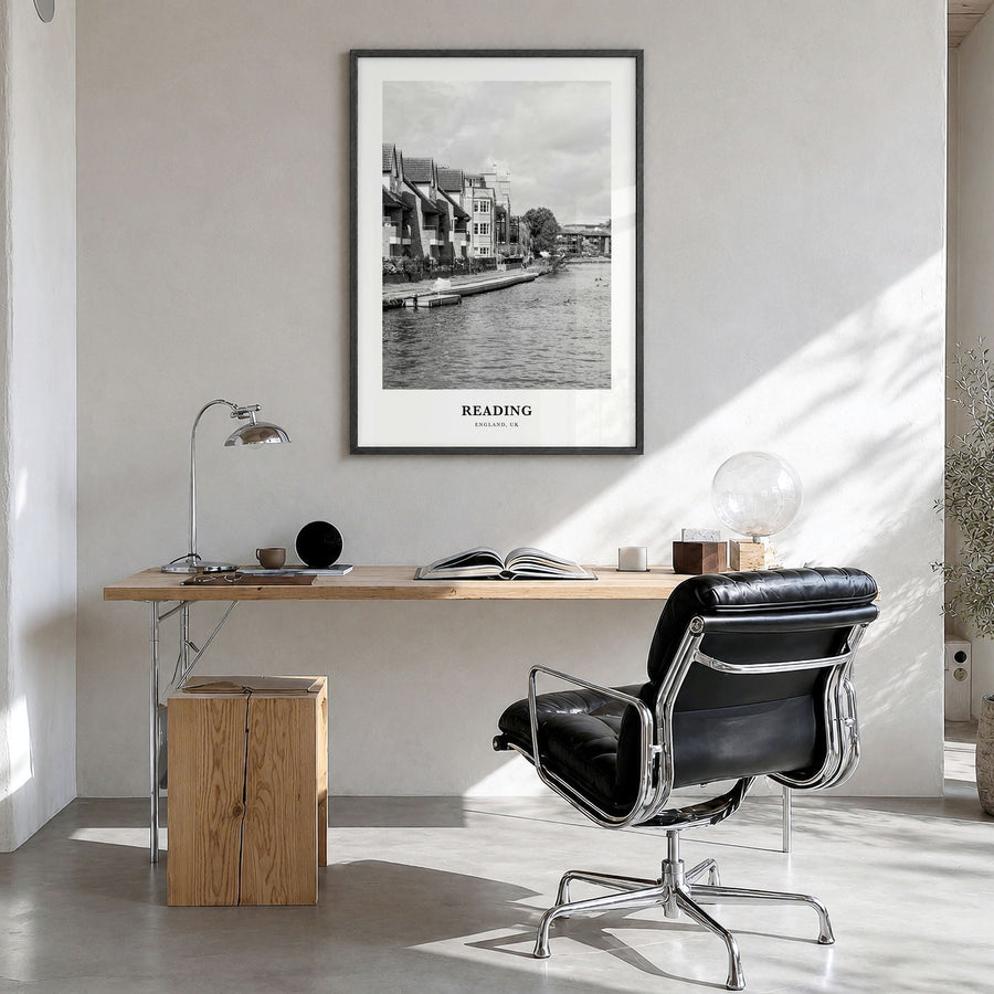 Reading, England Classic Poster in a black wood frame, hanging in a bright home office