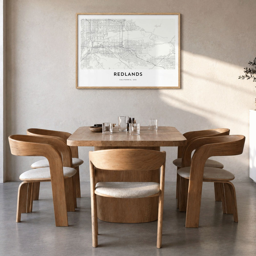 Redlands Map Poster in a natural wood frame, hanging in a dining room