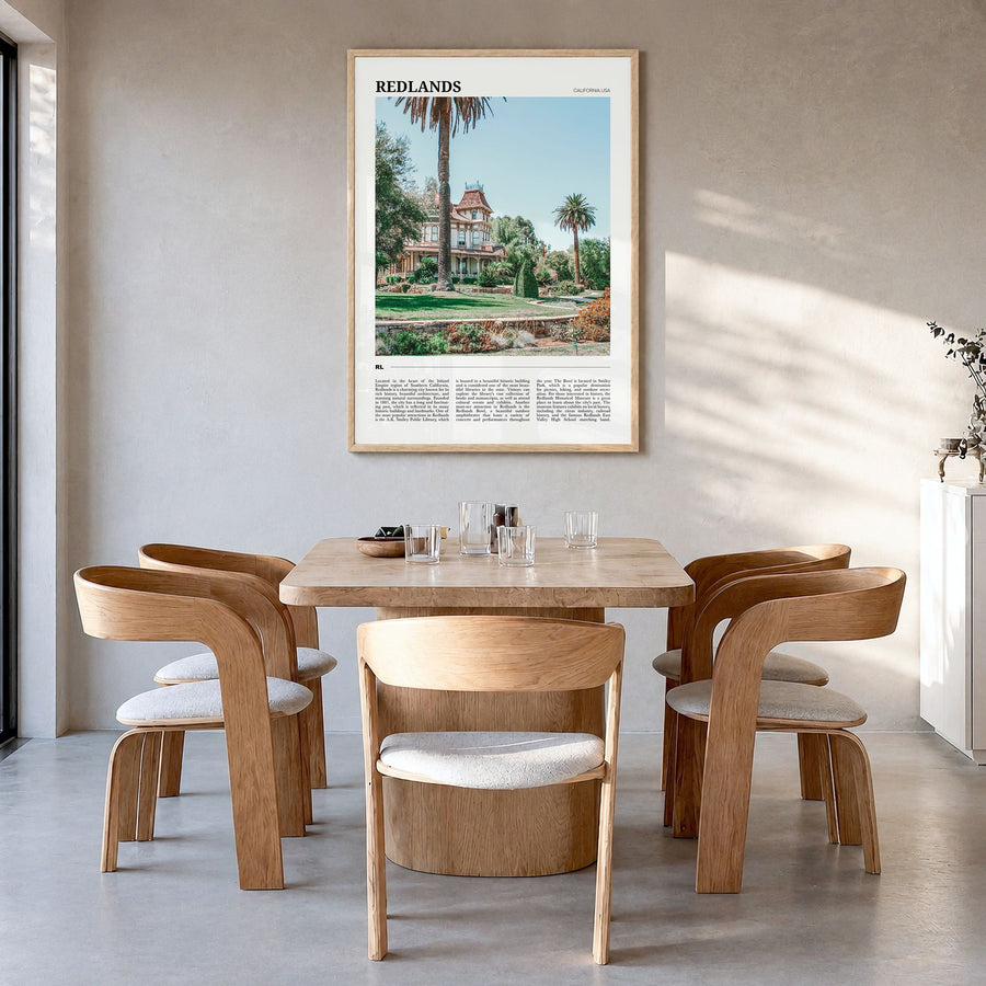 Redlands Travel Poster in a natural wood frame, hanging in a dining room