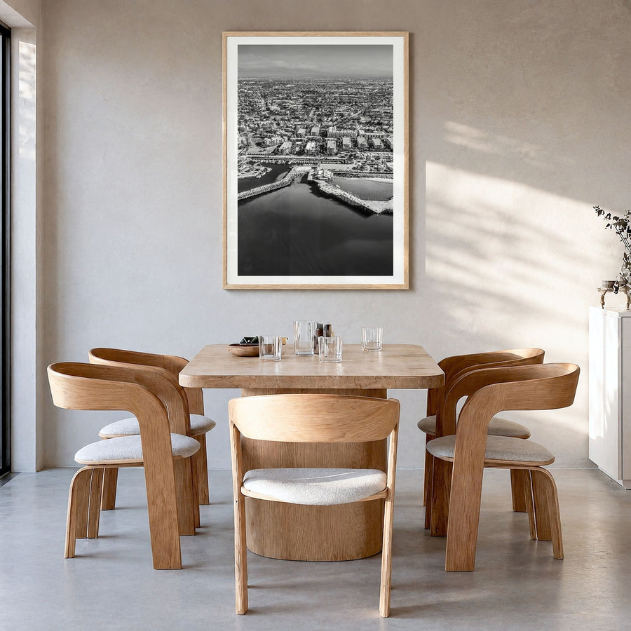 Redondo Beach Photo Poster in a natural wood frame, hanging in a dining room, white border