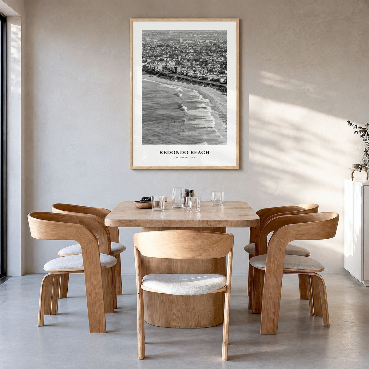 Redondo Beach Classic Poster in a natural wood frame, hanging in a dining room