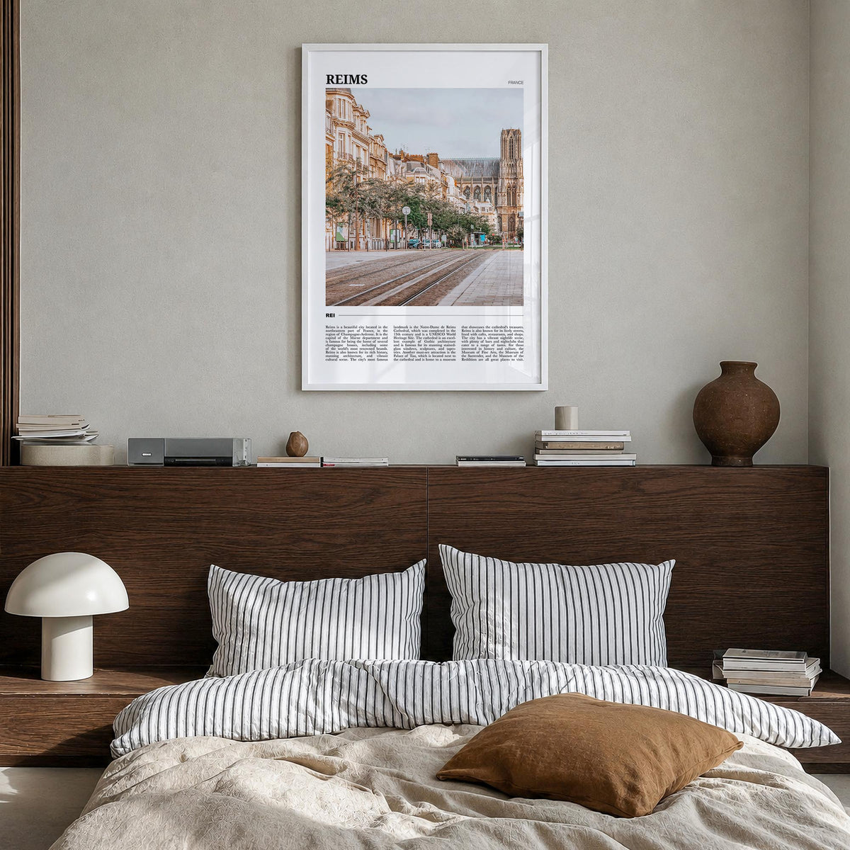 Reims colorful travel poster of France – vertical wall art in white wood frame, hanging on wall