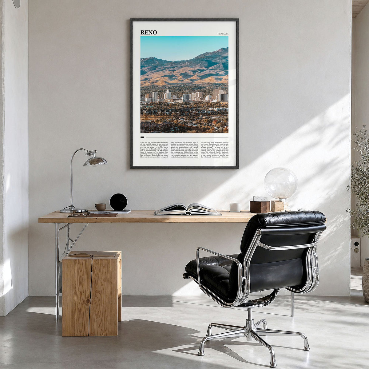 Reno Travel Poster in a black wood frame, hanging in a bright home office