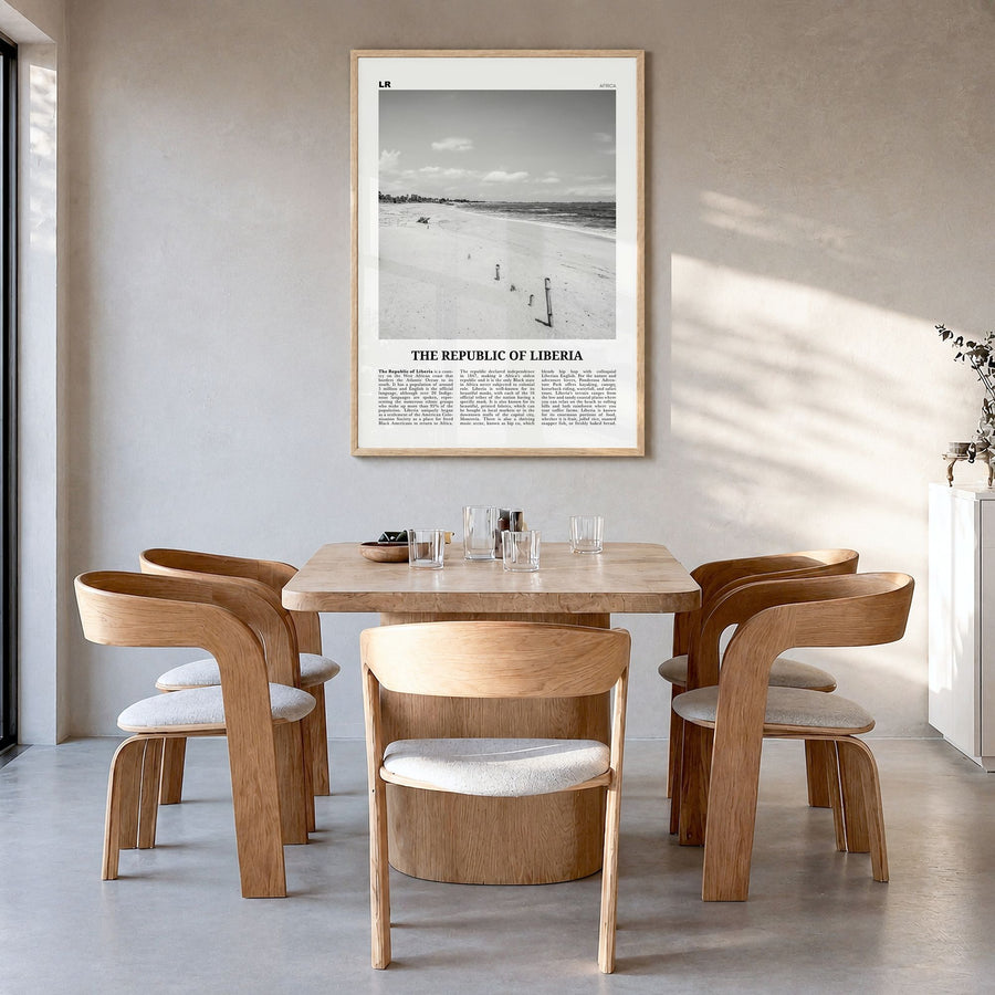The Republic of Liberia Newspaper Poster in a natural wood frame, hanging in a dining room
