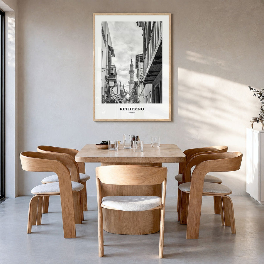 Rethymno Classic Poster in a natural wood frame, hanging in a dining room