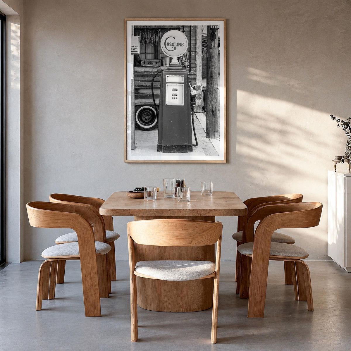 Retro Gas Pump black & white photo poster – vertical wall art in natural wood frame with white border, hanging on wall