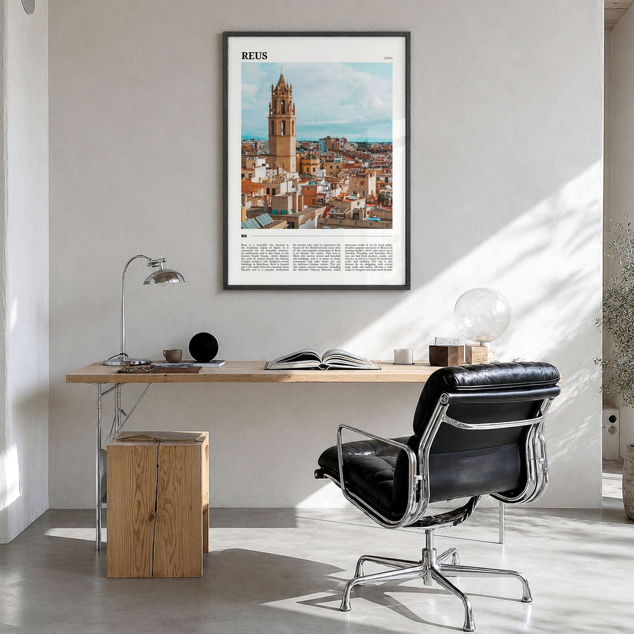 Reus Travel Poster in a black wood frame, hanging in a bright home office