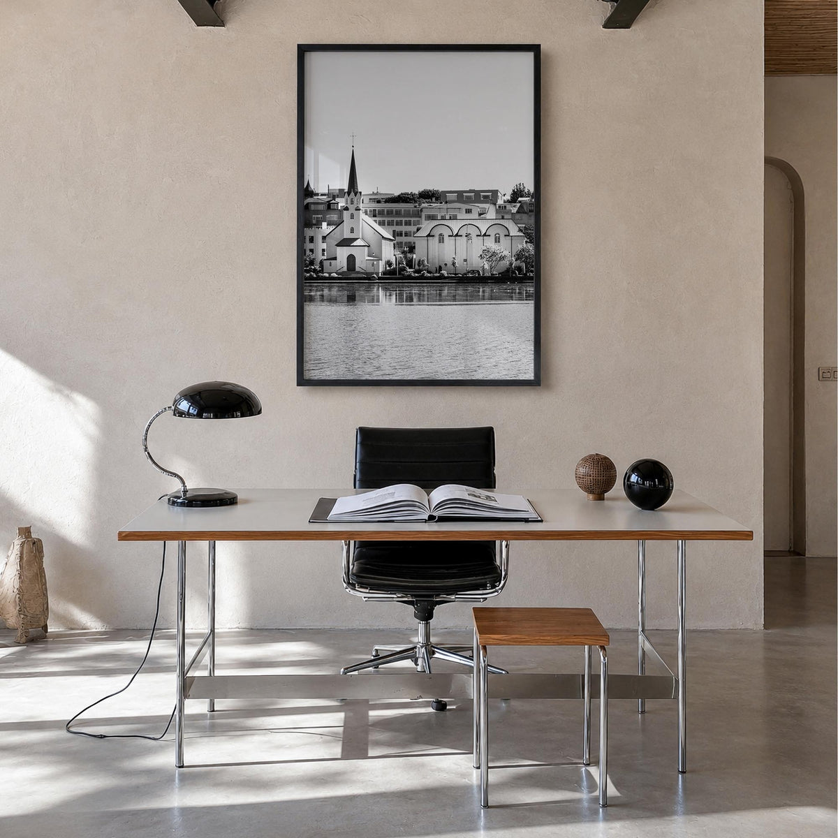 Reykjavík black & white photo poster of Iceland – vertical wall art in black wood frame, hanging on wall