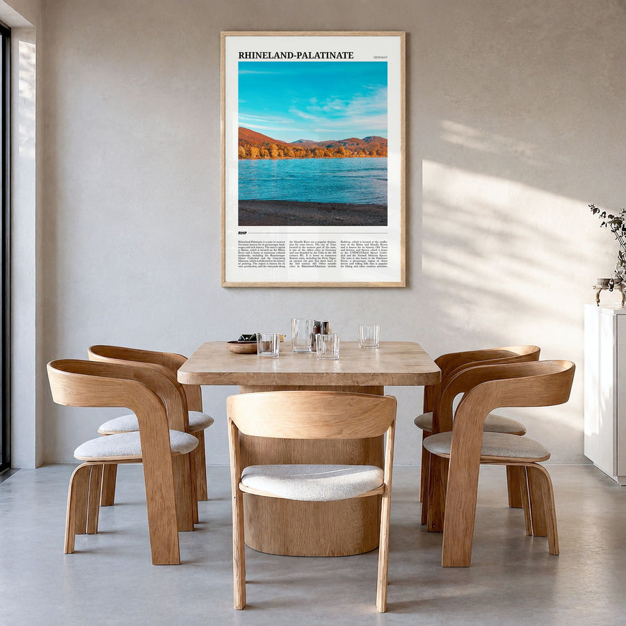 Rhineland-Palatinate Travel Poster in a natural wood frame, hanging in a dining room