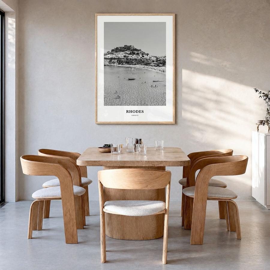 Rhodes Classic Poster in a natural wood frame, hanging in a dining room