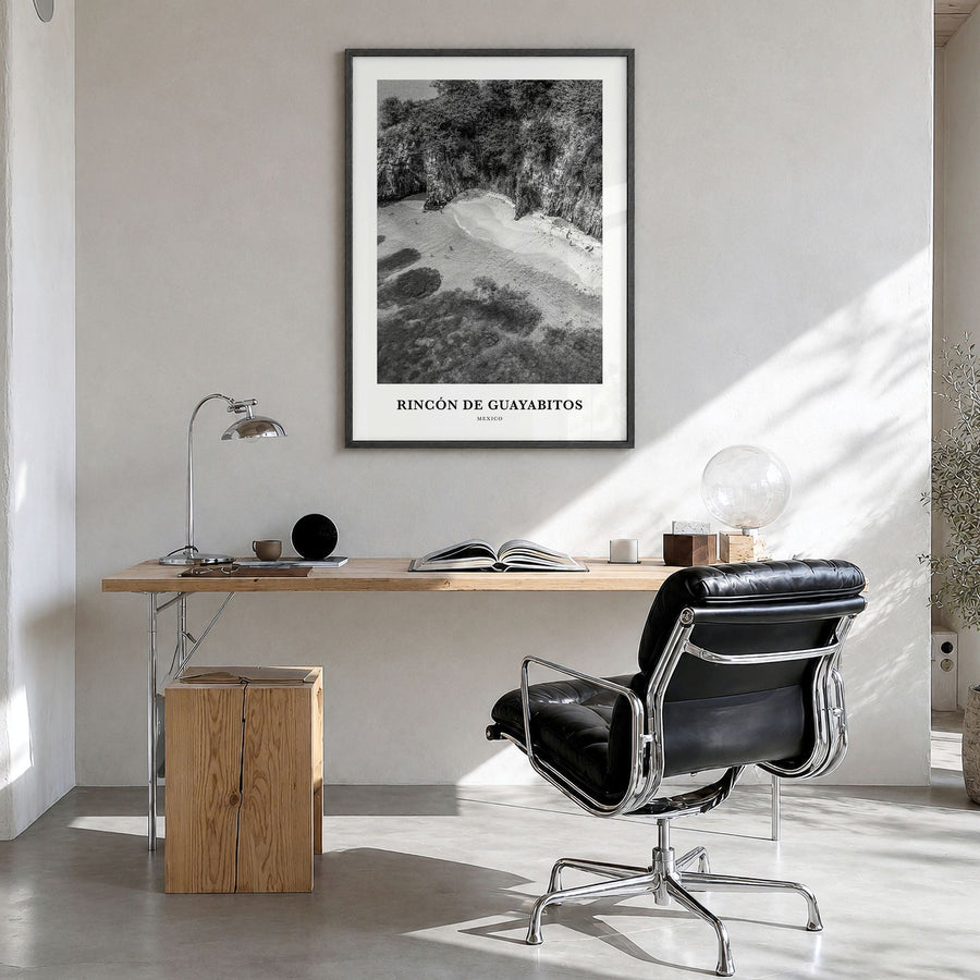 Rincón de Guayabitos Classic Poster in a black wood frame, hanging in a bright home office