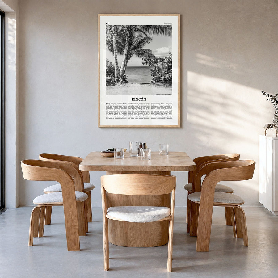 Rincón Newspaper Poster in a natural wood frame, hanging in a dining room