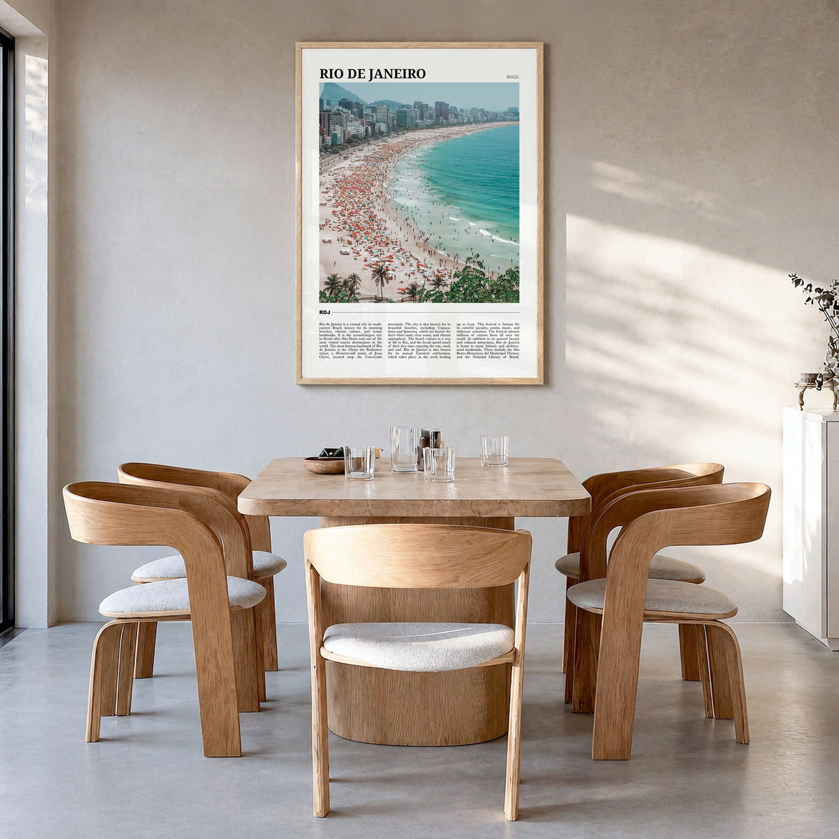Rio de Janeiro Travel Poster in a natural wood frame, hanging in a dining room