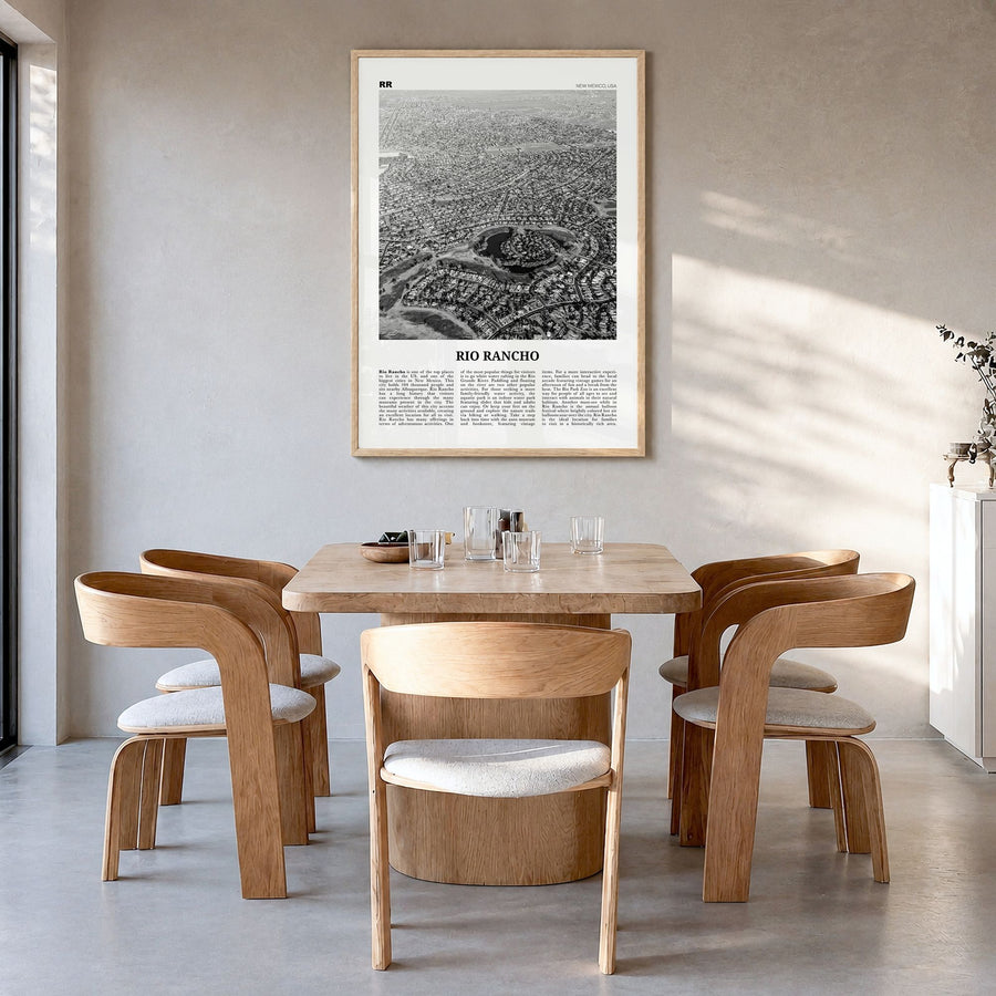 Rio Rancho Newspaper Poster in a natural wood frame, hanging in a dining room