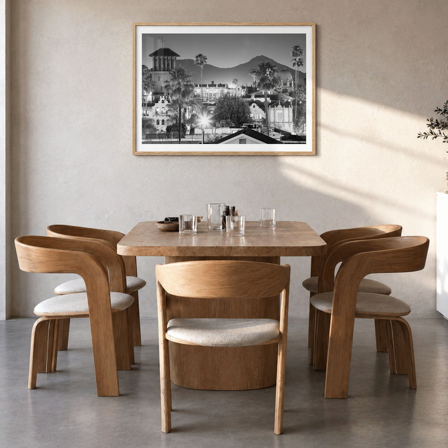Riverside Photo Poster in a natural wood frame, hanging in a dining room, white border