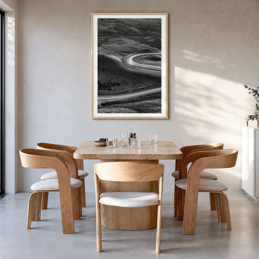 Road Photo No 2 Poster in a natural wood frame, hanging in a dining room, white border