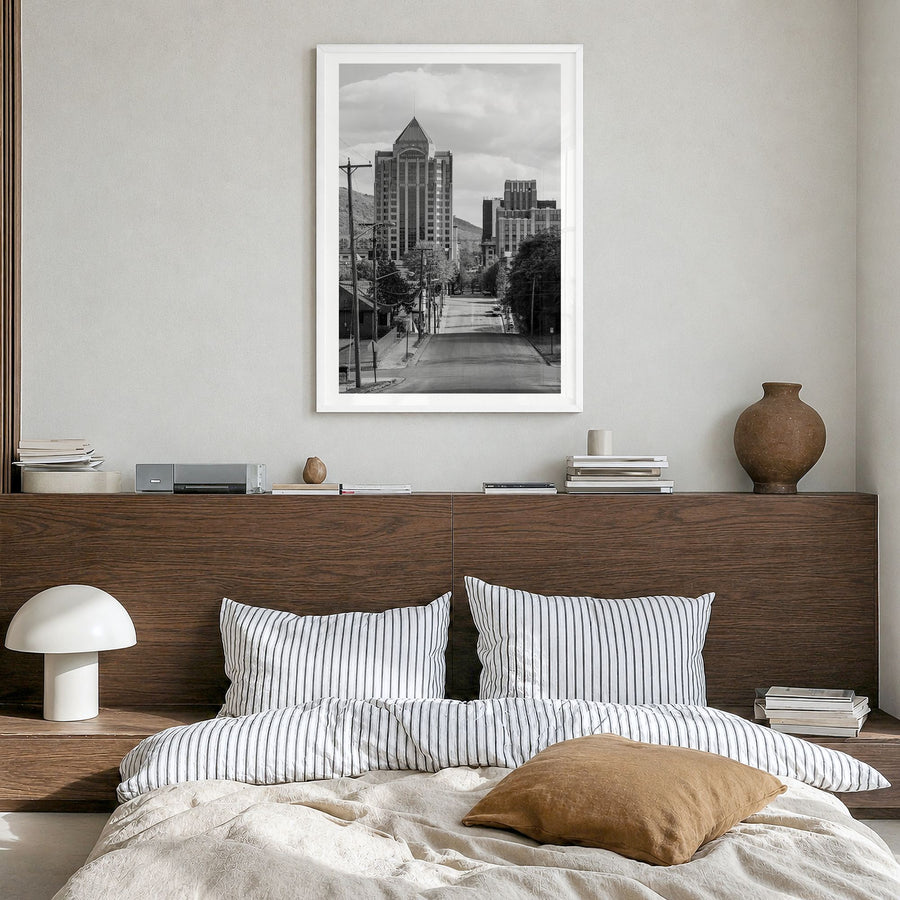 Roanoke Photo Poster in a white wood frame, hanging in a bedroom, white border