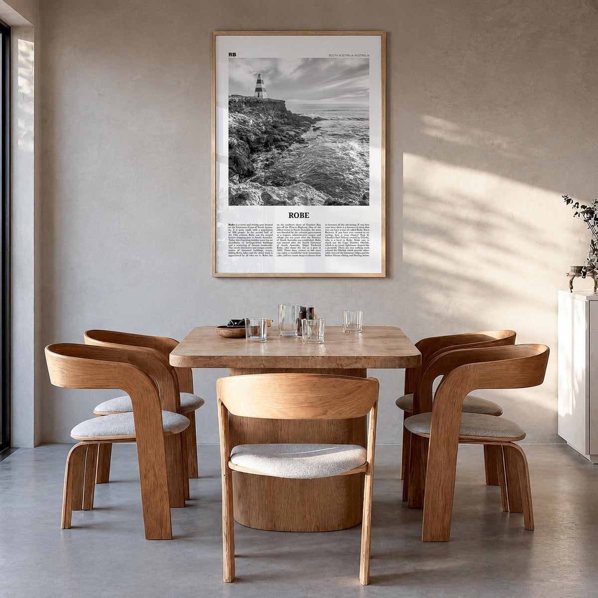 Robe black & white newspaper poster of Australia – vertical wall art in natural wood frame, hanging on wall