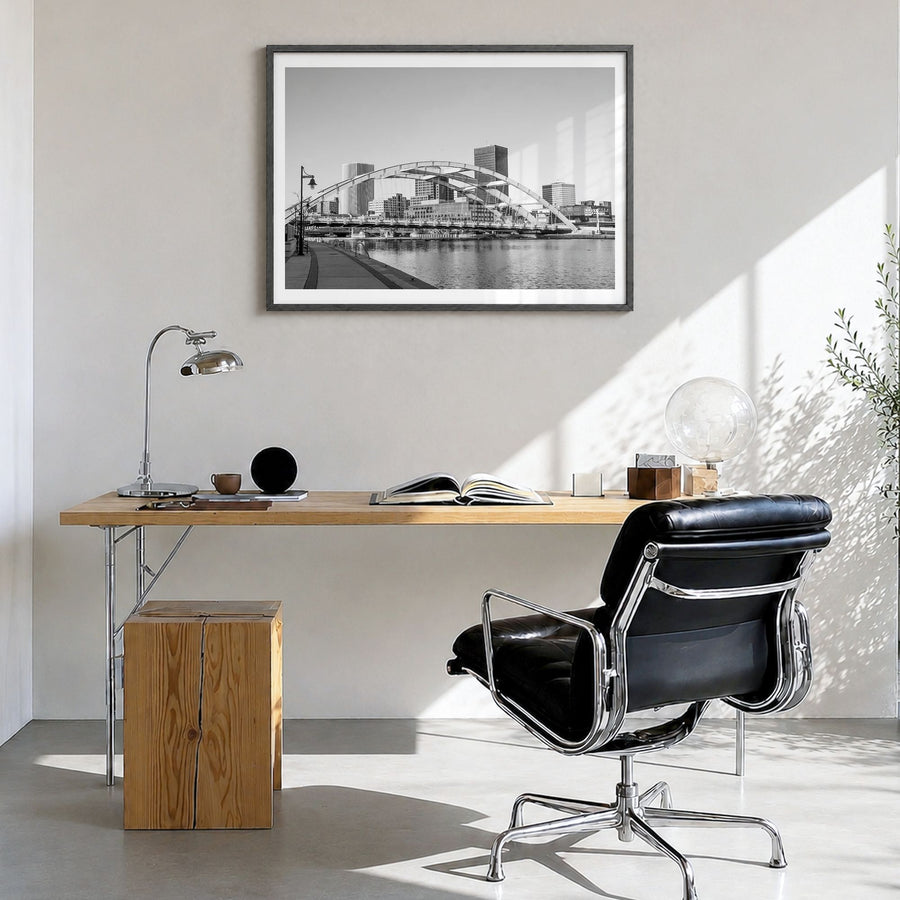 Rochester, New York Photo Poster in a black wood frame, hanging in a bright home office, white border