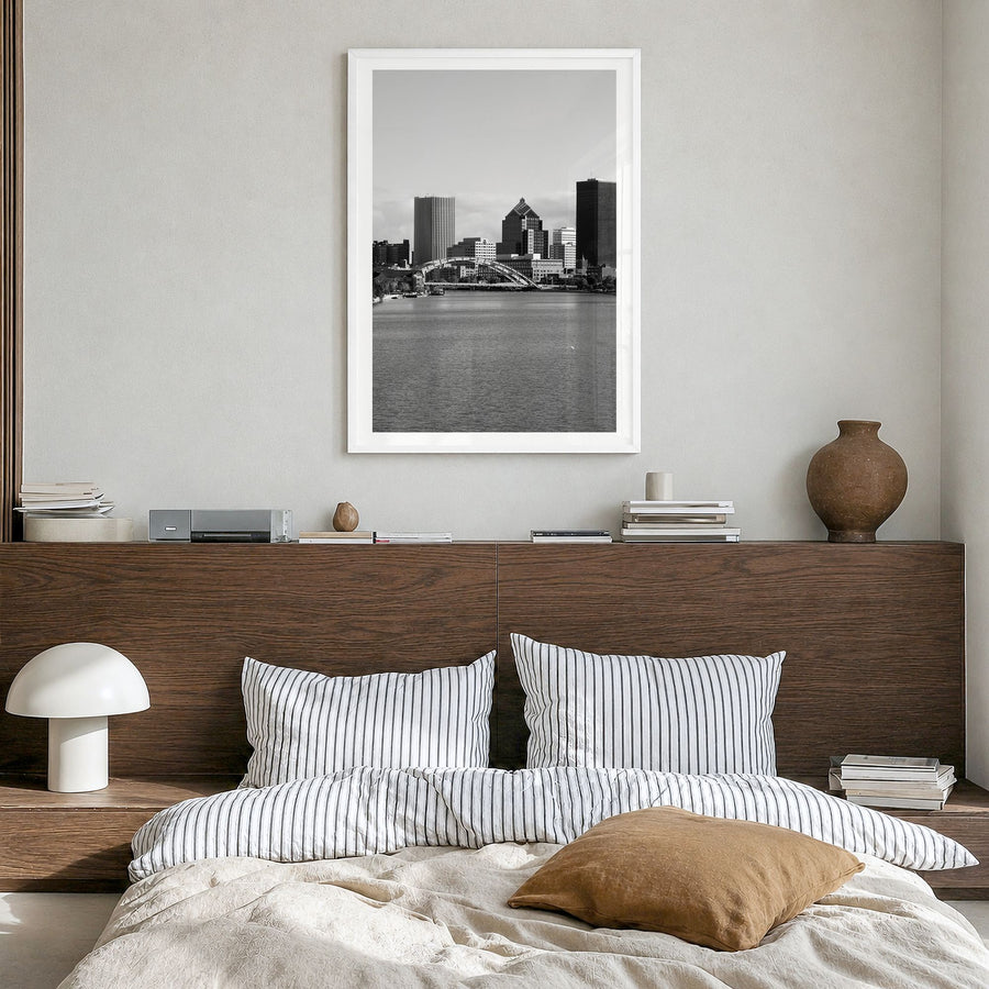 Rochester, New York Photo Poster in a white wood frame, hanging in a bedroom, white border