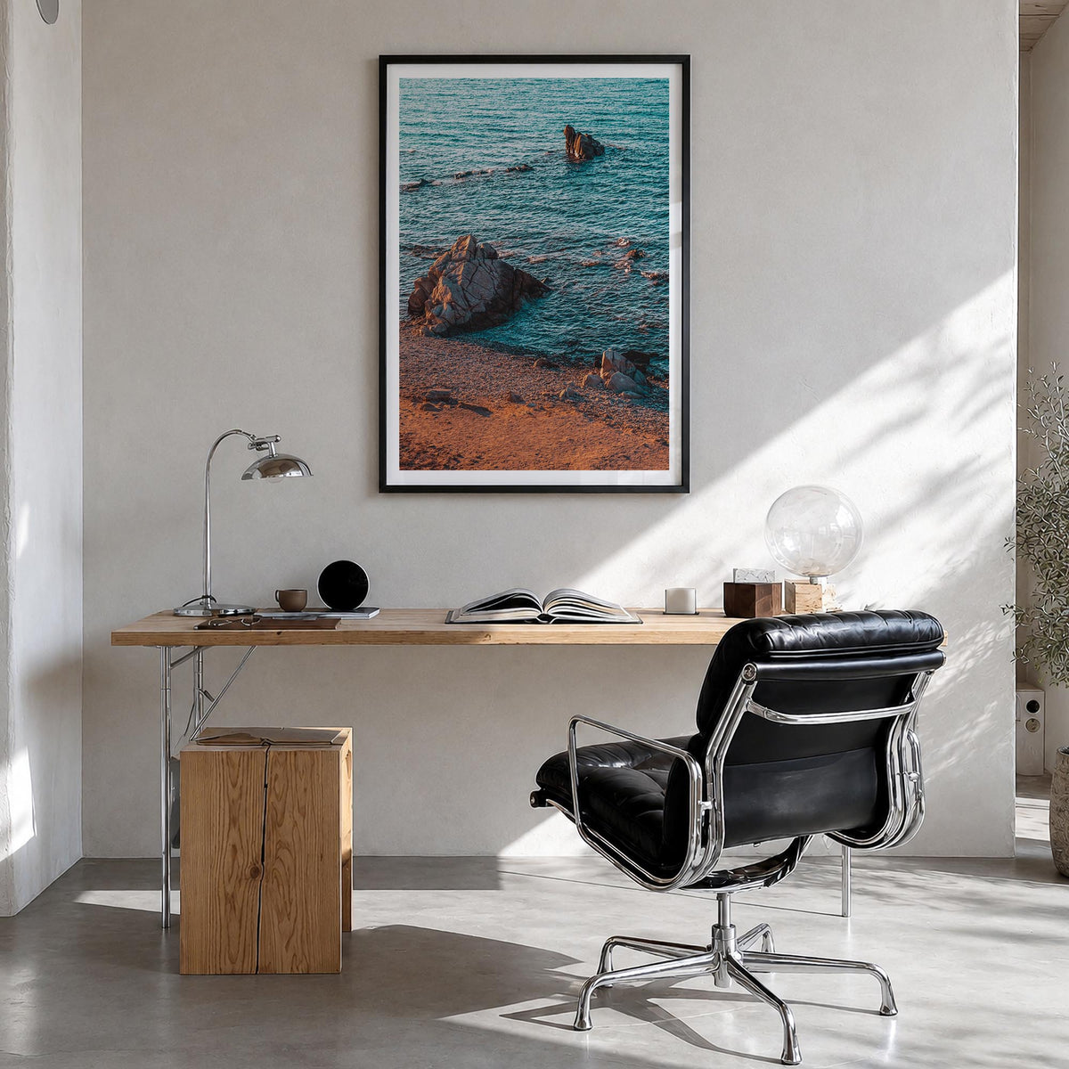 Rock Beach colorful photo poster – vertical wall art in black wood frame with white border, hanging on wall