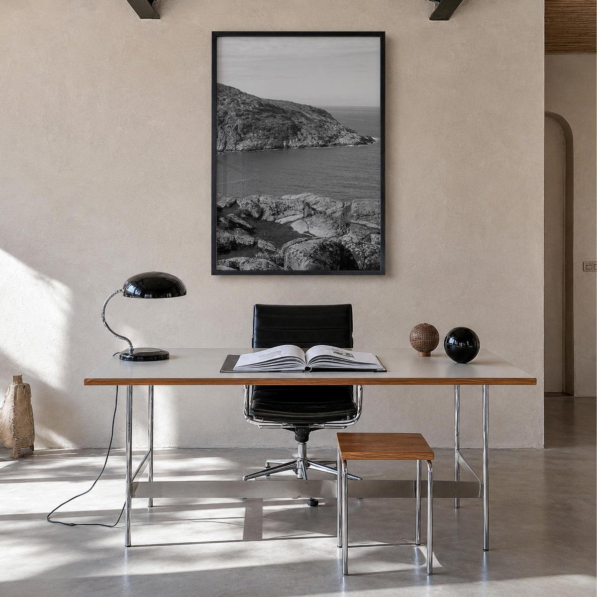 Rocky Coast no. 1 black & white photo poster – vertical wall art in black wood frame, hanging on wall