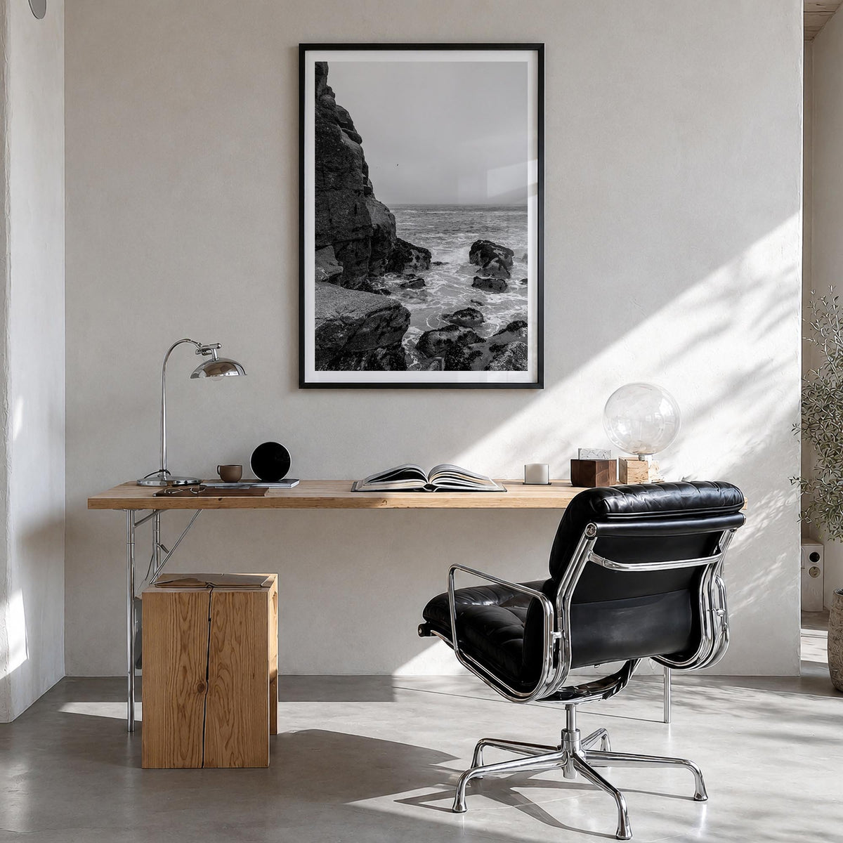 Rocky Coast no. 2 black & white photo poster – vertical wall art in black wood frame with white border, hanging on wall