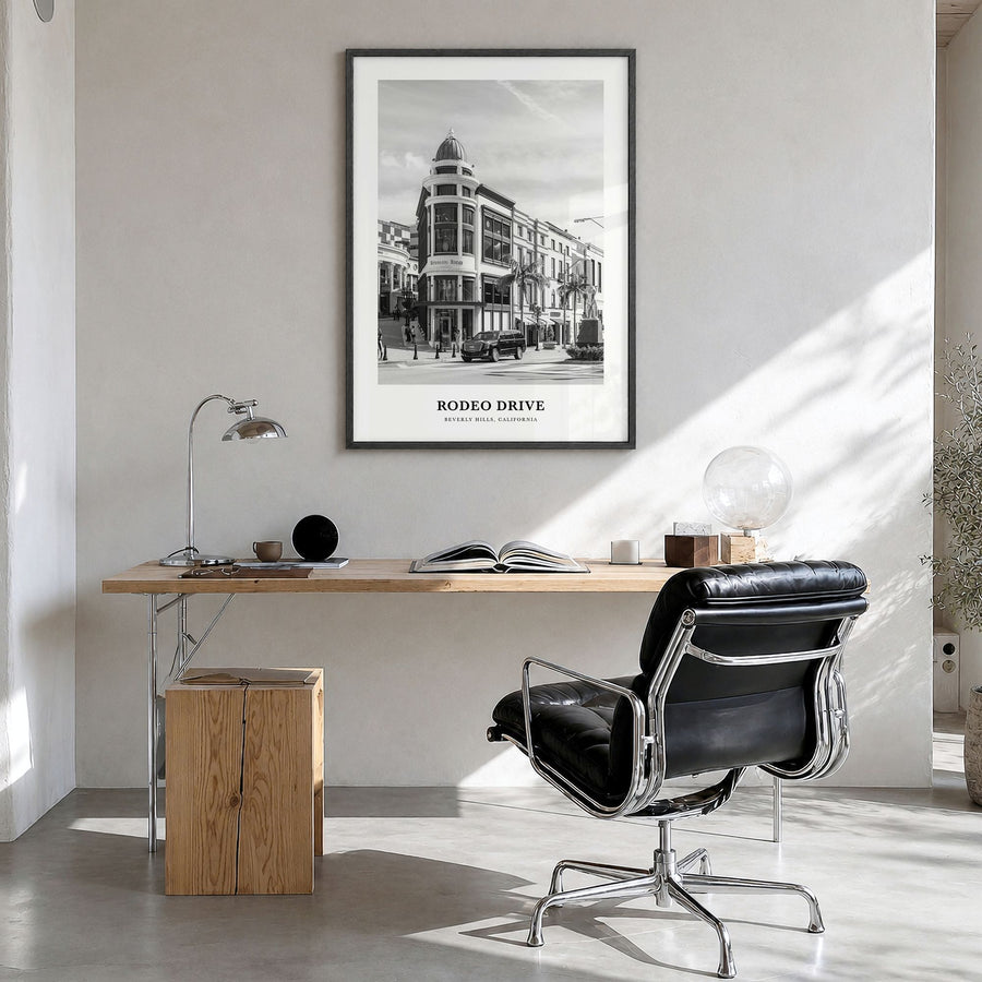 Rodeo Drive Classic Poster in a black wood frame, hanging in a bright home office