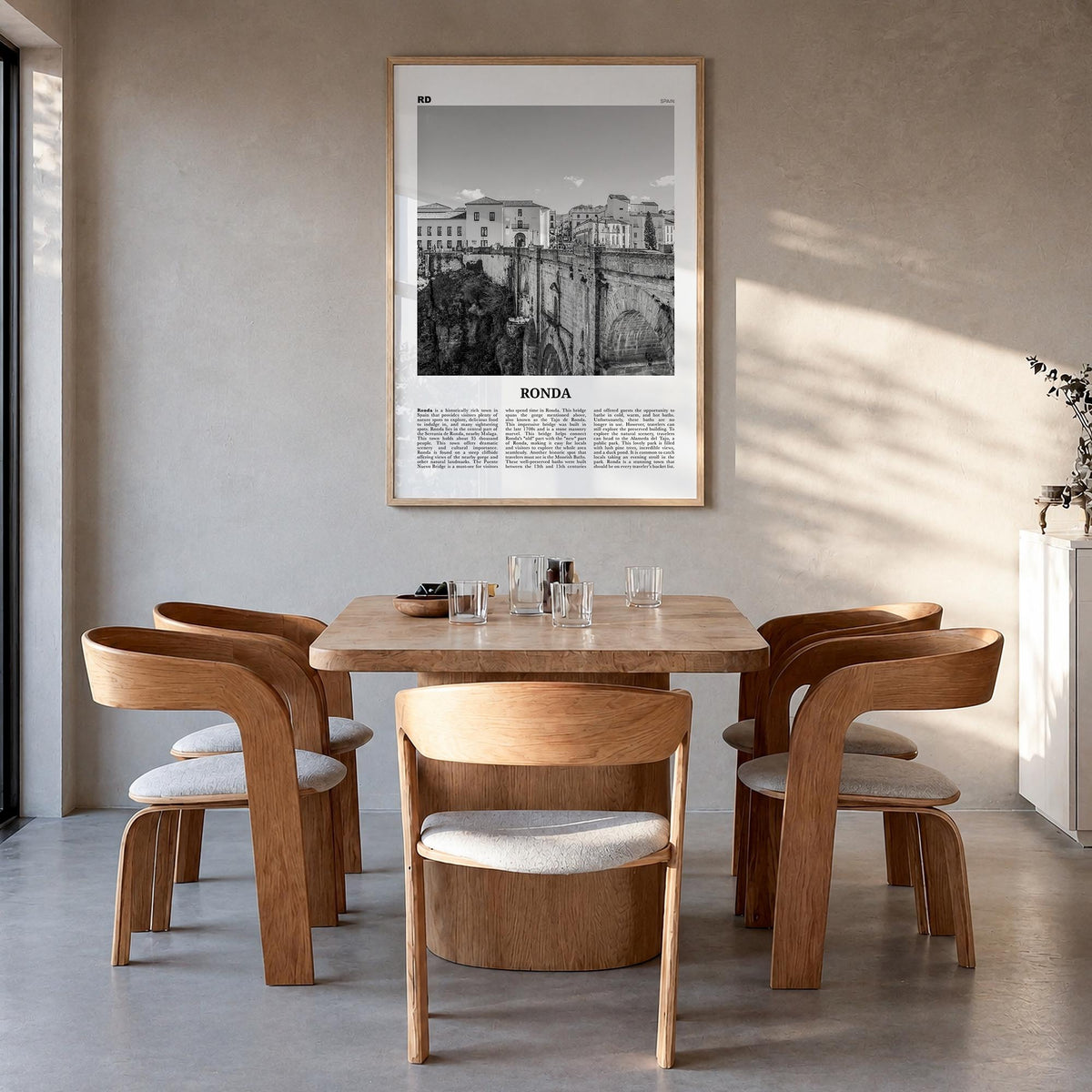 Ronda black & white newspaper poster of Spain – vertical wall art in natural wood frame, hanging on wall