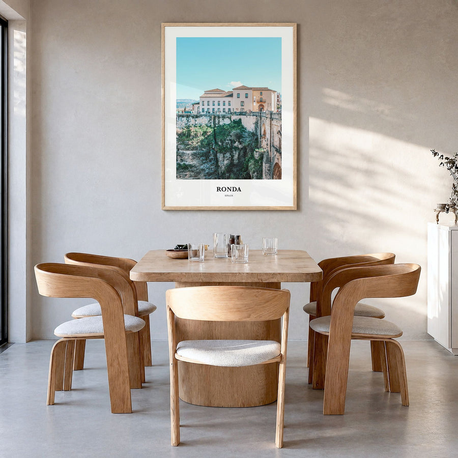 Ronda Classic Poster in a natural wood frame, hanging in a dining room