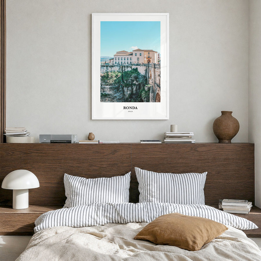 Ronda Classic Poster in a white wood frame, hanging in a bedroom