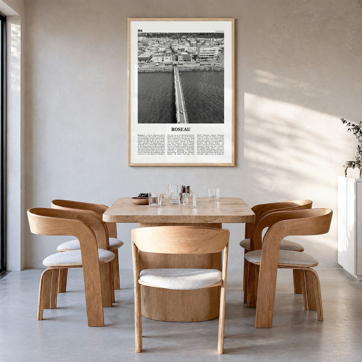 Roseau Newspaper Poster in a natural wood frame, hanging in a dining room