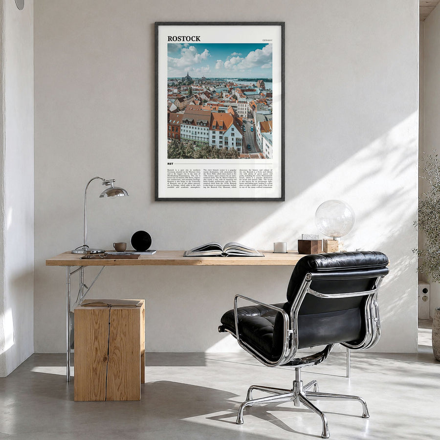 Rostock Travel Poster in a black wood frame, hanging in a bright home office