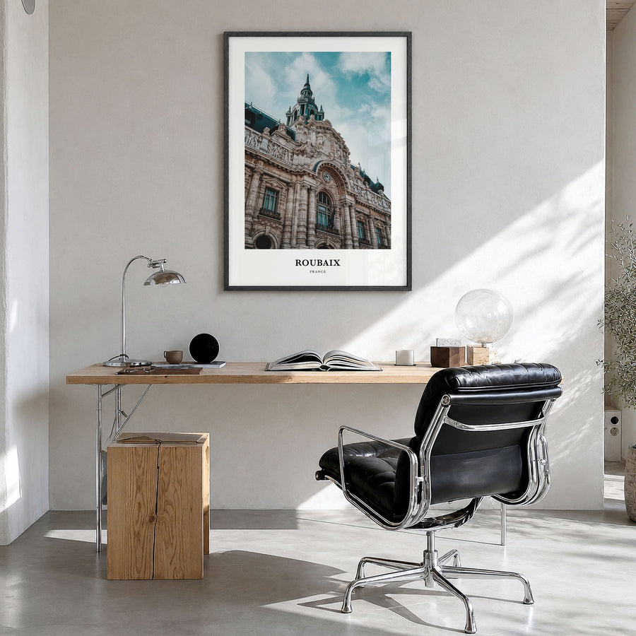 Roubaix Classic Poster in a black wood frame, hanging in a bright home office