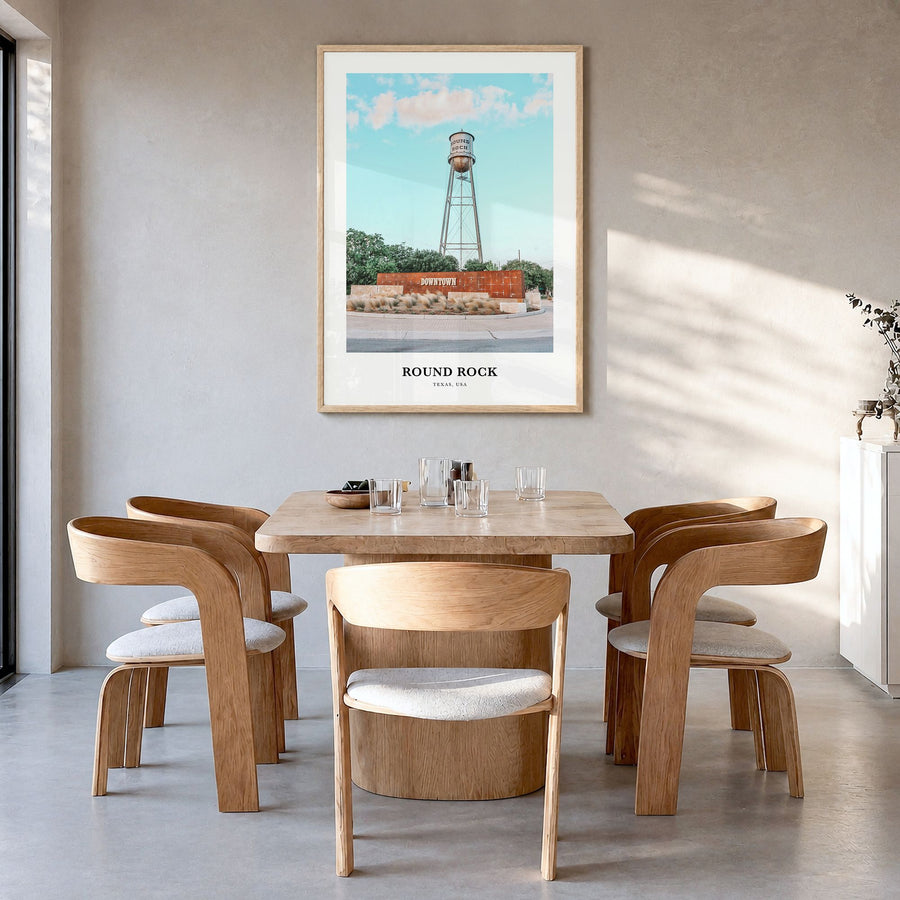 Round Rock Classic Poster in a natural wood frame, hanging in a dining room