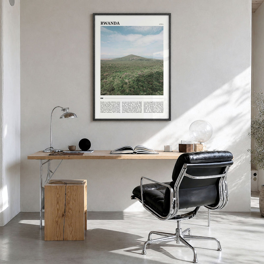 Rwanda Travel Poster in a black wood frame, hanging in a bright home office