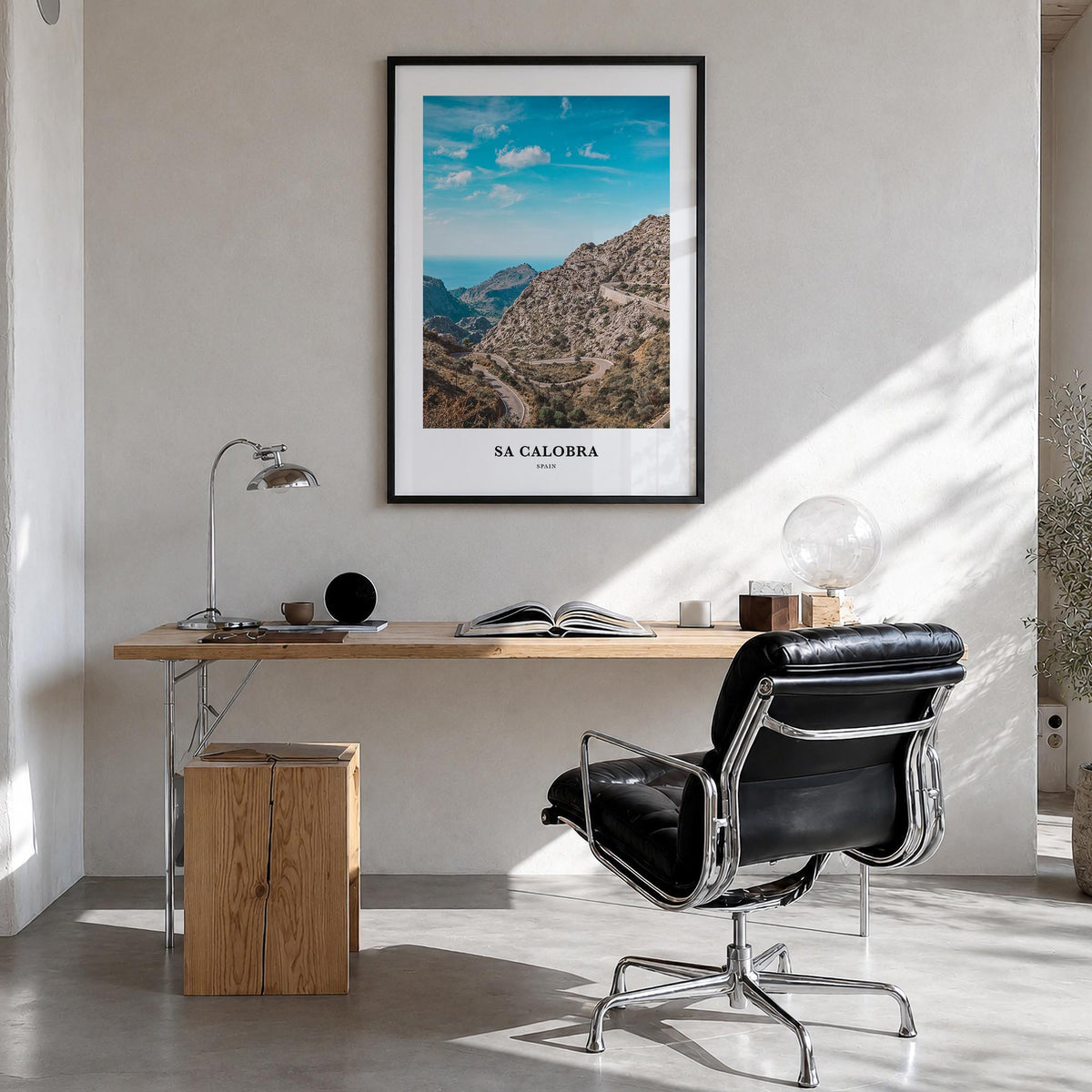 Sa Calobra colorful classic poster of Spain – vertical wall art in black wood frame, hanging on wall