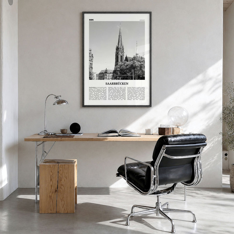 Saarbrücken Newspaper Poster in a black wood frame, hanging in a bright home office