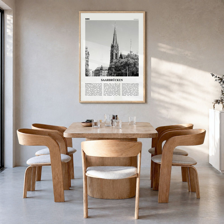 Saarbrücken Newspaper Poster in a natural wood frame, hanging in a dining room